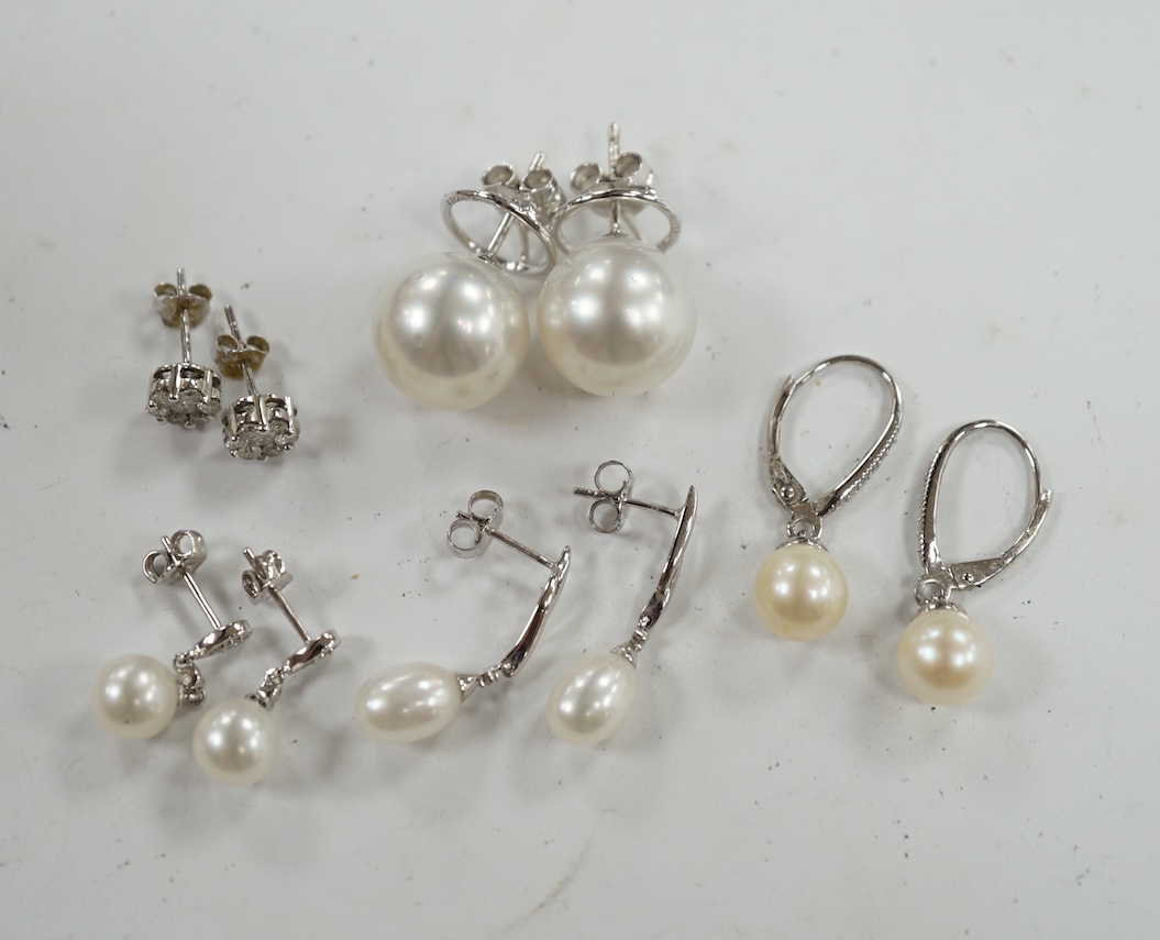 Three assorted modern pairs of 9ct, cultured pearl and diamond chip set earrings, a similar diamond cluster pair and a pair of cultured pearl earrings. Condition - fair to good